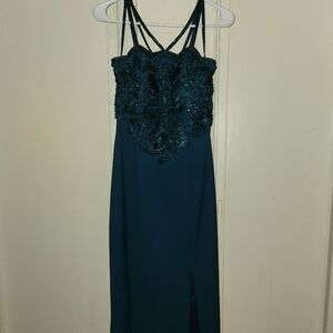 Emerald green prom dress, worn once. Bejeweled top, silky bottom with hip slit.